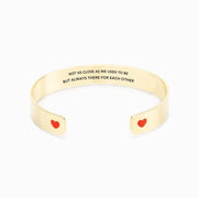 Not as close as we used to be but always there for each other heart bangle