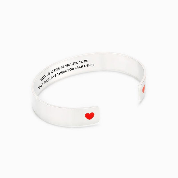 Not as close as we used to be but always there for each other heart bangle