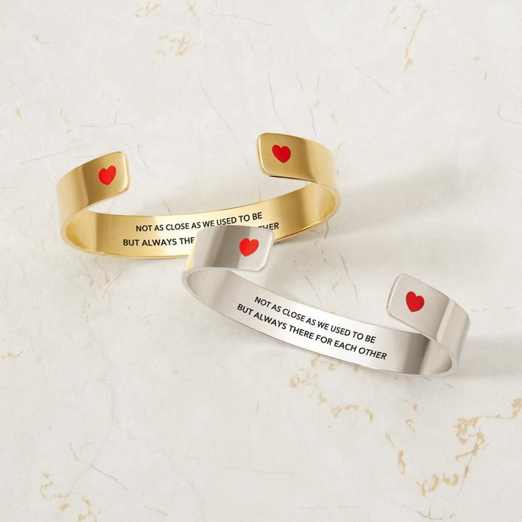 Not as close as we used to be but always there for each other heart bangle